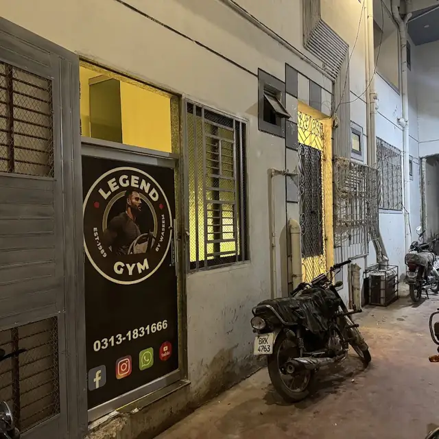 Legend Gym entrance at night with its sign